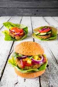 Vegan Burger in three variations, with salad, corn and gluten free bread