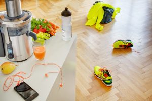 Juicer with juice and jogging outfit