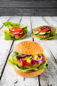 Vegan Burger in three variations, with salad, corn and gluten free bread
