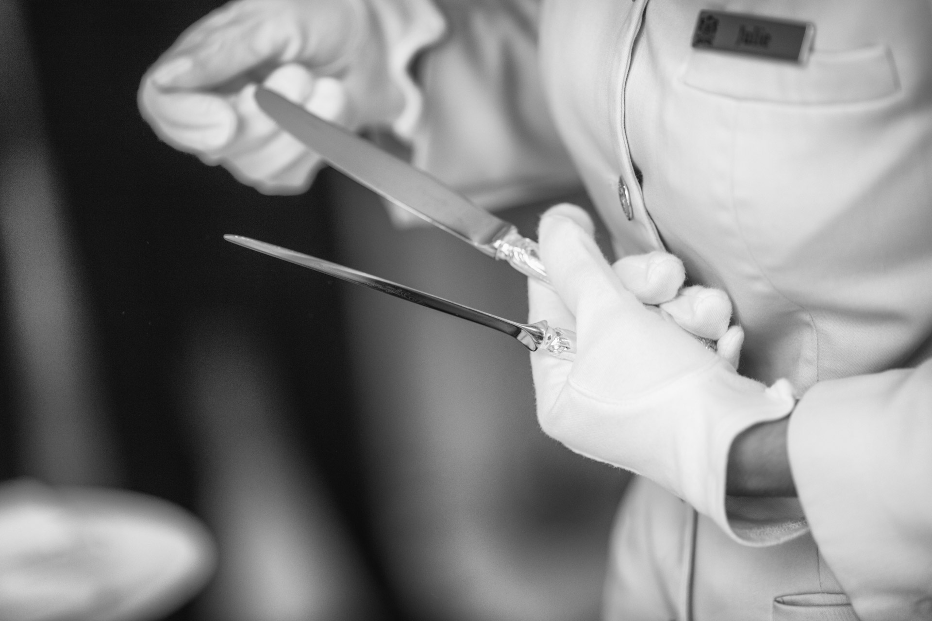 Waiter polishes knifes at the restaurant of Hotel Le Bristol Paris