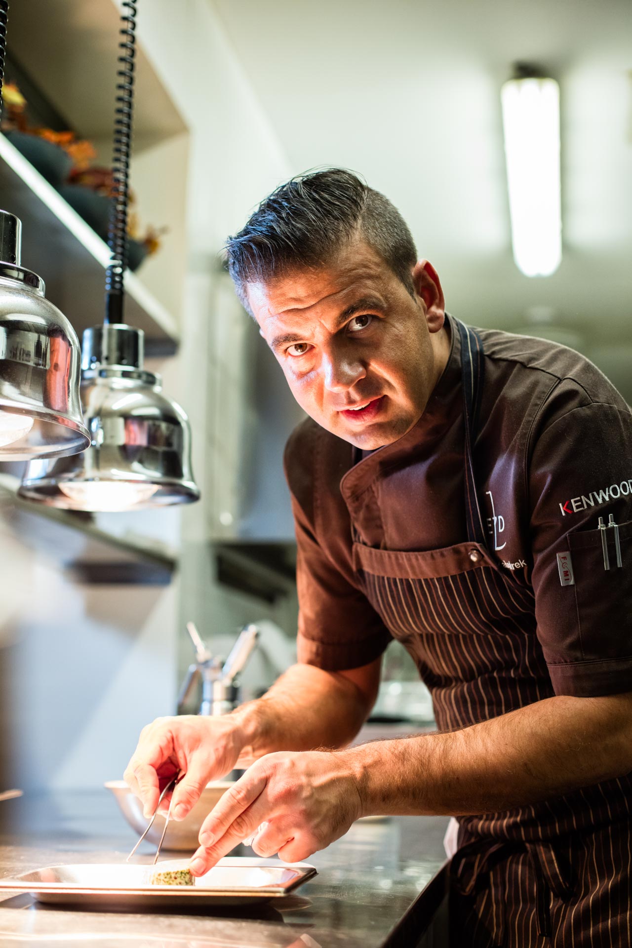 Michelin Star Chef Radek Kasparek preparing beetroot in the kitchen of his restaurant Field